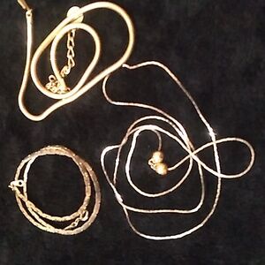 3 gold tone necklaces one is 15-in, one is 19-in and 28 in